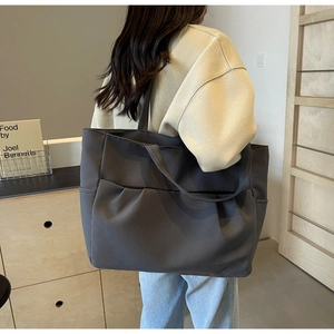 Charcoal gray large canvas tote bag with wide strap for daily commuting and student use