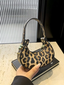 Fashionable leopard print crescent handbag with gold hardware and lychee pattern finish