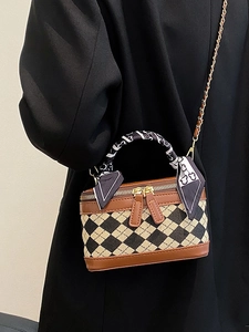 Chic quilted crossbody bag with brown trim and bear scarf accent on gold chain
