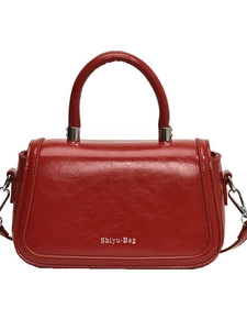 Elegant red glossy patent leather square handbag with top handle and silver metal hardware