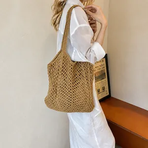 Detailed texture of hollow mesh cotton thread woven tote bag in a casual summer style