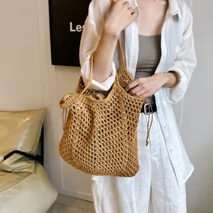 Detail of hollow woven cotton tote with drawstring inner pouch and rustic beige texture