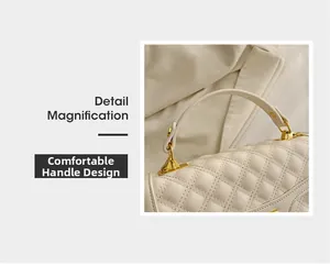 Vue détaillée de la poignée confortable et des ferrures dorées du sac matelassé