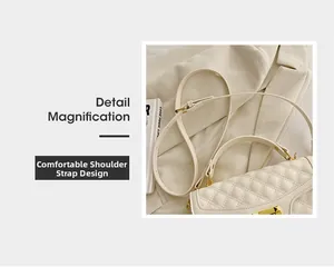 Gros plan sur la bandoulière en cuir réglable et la boucle dorée du sac matelassé