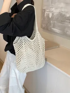 Large white woven cotton tote bag featuring minimalist hollow mesh design and shoulder strap