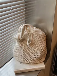 Minimalist cream-white hollow woven cotton tote bag with drawstring inner pouch