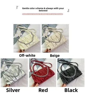 Detail showing various colors of pleated leather shoulder bags with silver chains