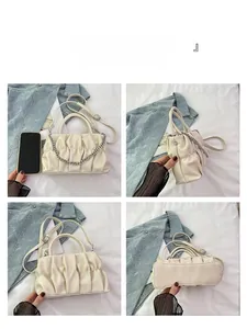 Detailed views of beige ruched cloud bag with silver chain and adjustable strap
