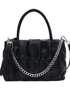 Fashionable black pleated square handbag with a silver chain and adjustable shoulder strap