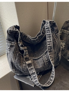 Retro washed charcoal denim hobo bag featuring large capacity and distressed edge details