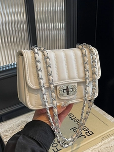 White quilted crossbody bag with diamond-encrusted twist lock and chain strap for women