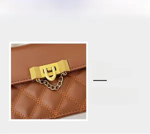 Details von braunem gestepptem Leder und Premium Gold-Metallverschluss mit feiner Kette