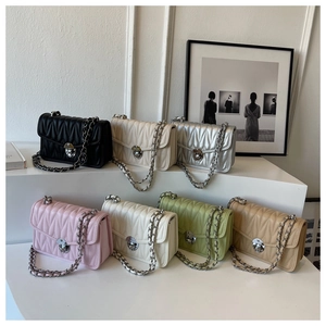 Detailed display of seven color options for quilted crossbody bags with chain straps