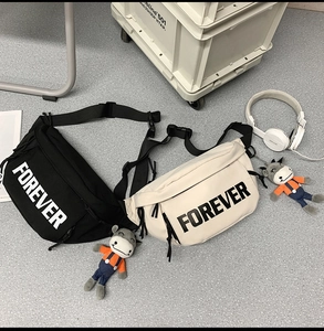 Detail of canvas waist bags with FOREVER text and cute donkey doll accessories