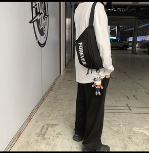 Street style black crossbody bag with white FOREVER text and cow plush keychain charm