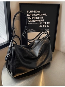 Classic black leather Boston bag with dual straps and large capacity for daily commute