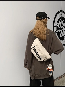 Beige canvas crossbody bag with FOREVER lettering and cute cartoon bull pendant charm