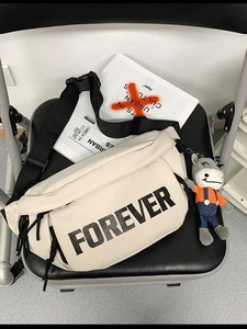 Cream crossbody chest bag with Forever lettering and cute plush donkey pendant charm