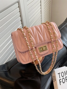 Pink quilted leather crossbody bag with gold chain strap and turn-lock closure