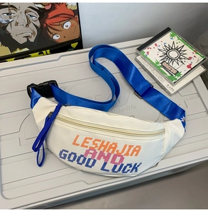 Close-up of white waist bag with pixel art text and vibrant blue woven shoulder strap