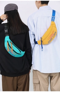 Detail of vibrant blue and yellow waist bags with adjustable straps and sturdy plastic buckles