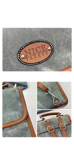 Macro detail of vintage washed denim fabric with leather trim and silver metal buckles