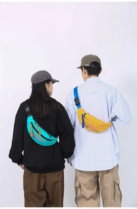 Detail view of adjustable strap and plastic buckle on nylon streetwear waist bags