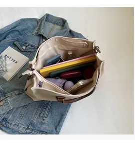 Detail view of large nylon tote bag with spacious interior compartments and zipper closure