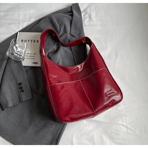 Deep red vintage PU leather tote bag with white stitching and exterior pockets