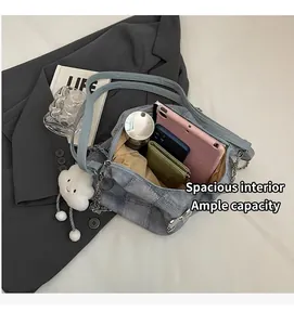Detail view of large capacity light blue denim tote bag interior with storage space