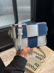 Silver leather and blue denim checkerboard crossbody bag with adjustable silver buckle strap