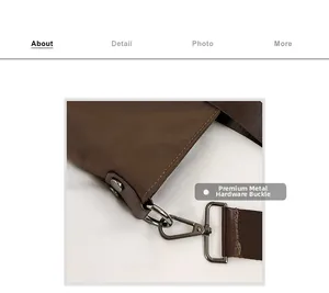 Close-up of silver metal lobster clasp and adjustable buckle on dark brown tote bag