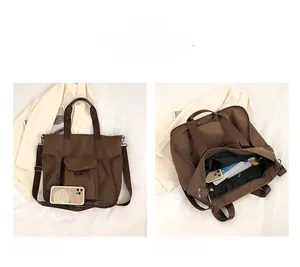 Large brown nylon tote bag internal storage space and mobile phone size comparison