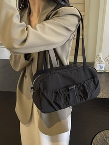 Fashionable black pleated hobo bag with drawstring detail and slim shoulder straps
