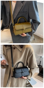 Close-up of stylish crossbody bags in mustard green and black with V-cut flap detailing