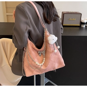 Pink quilted tote with silver bow, pearl chain strap and cloud plush charm detail