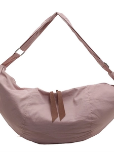 Pink nylon half-moon crossbody bag with wide shoulder strap and leather pullers