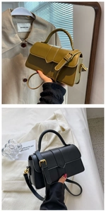 Close-up of minimalist crossbody bag featuring gold hardware and smooth leather finish