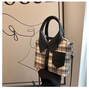 Detailweergave van de creatieve handtas met overhemdkraag en geelgrijs ruitpatroon