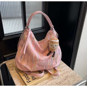 Pink pleated Hobo bag featuring colorful stripe embroidery and a cute coffee cup plush charm