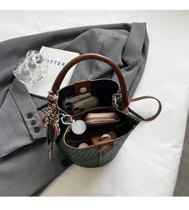 Detail view of woven bucket bag interior showing spacious capacity for daily essentials