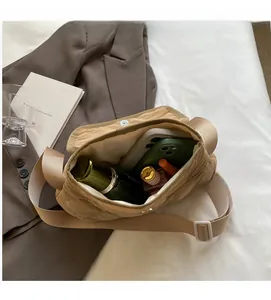 Detailed interior of quilted crossbody bag showing spacious capacity for daily items