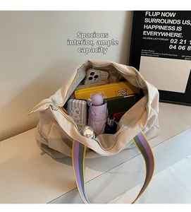 Spacious interior of large beige canvas tote bag showing items for daily storage