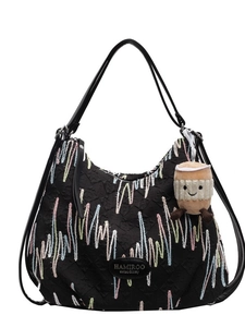 Black quilted shoulder bag with colorful wave embroidery and plush coffee cup pendant