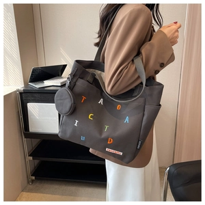 Fashionable grey canvas tote bag for women with colorful letter embroidery and charm