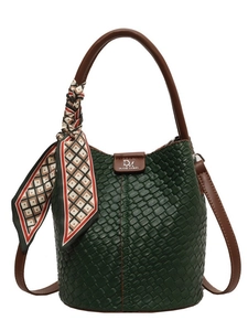 Dark green woven bucket bag with brown handles and elegant geometric silk scarf detail