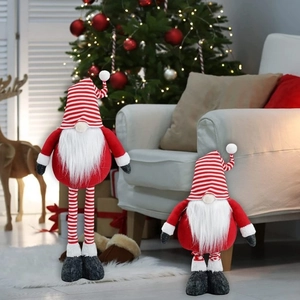 Standing Christmas gnomes with striped hats and retractable legs in festive home setting