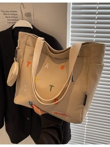 Beige canvas tote bag with colorful letter embroidery and coin pouch for daily use