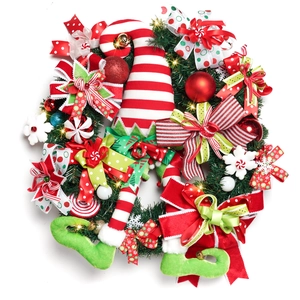 Lighted Christmas elf wreath with red striped hat and legs on green pine needle base
