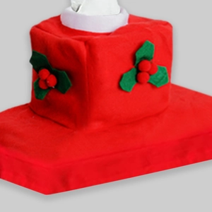 Close-up of red felt Christmas toilet cover with festive holly berry decor and white collar